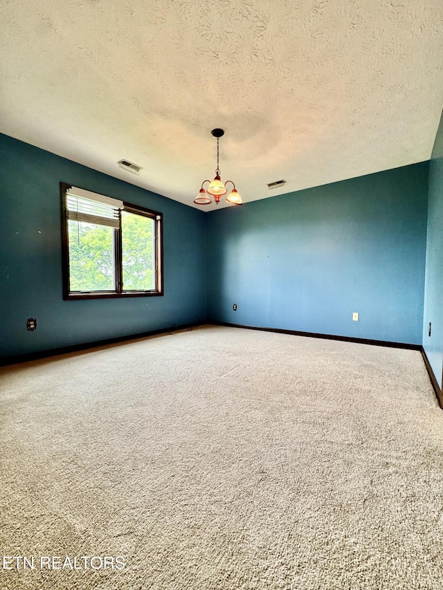 721 Fan St, Tazewell, TN 37879 - empty room with carpet flooring, a textured ceiling, a chandelier, and baseboards