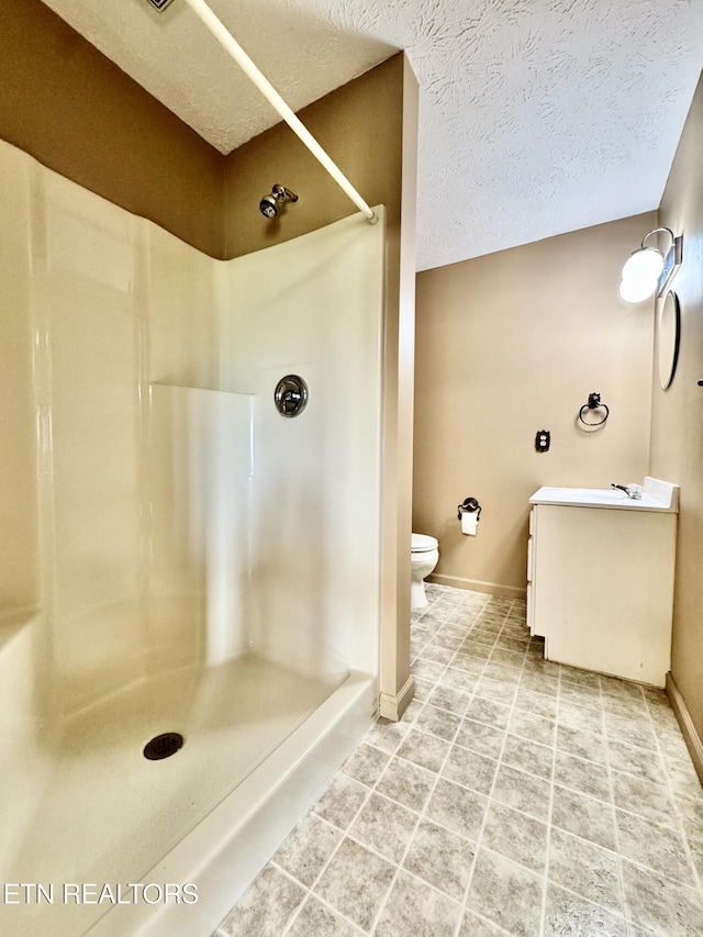 721 Fan St, Tazewell, TN 37879 - full bathroom featuring toilet, a shower, baseboards, vanity, and a textured ceiling
