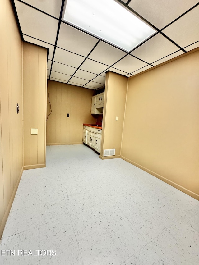 721 Fan St, Tazewell, TN 37879 - finished below grade area featuring baseboards, a drop ceiling, and light floors