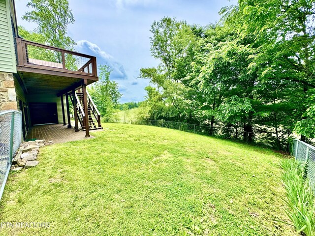 721 Fan St, Tazewell, TN 37879 - view of yard with stairs and a wooden deck
