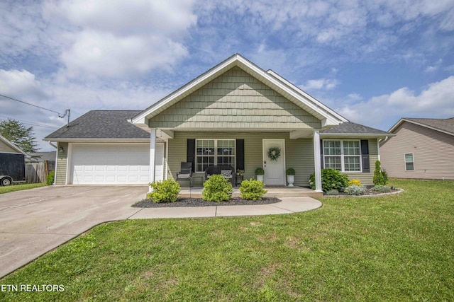 155 Signet Ln, Maynardville, TN 37807 - view of front of property with concrete driveway, covered porch, a garage, and a front lawn