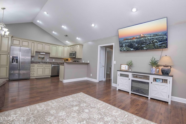 155 Signet Ln, Maynardville, TN 37807 - kitchen featuring cream cabinets, stainless steel appliances, dark wood-type flooring, recessed lighting, and high vaulted ceiling