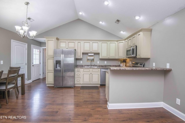 155 Signet Ln, Maynardville, TN 37807 - kitchen with stainless steel appliances, cream cabinets, a sink, a peninsula, and pendant lighting