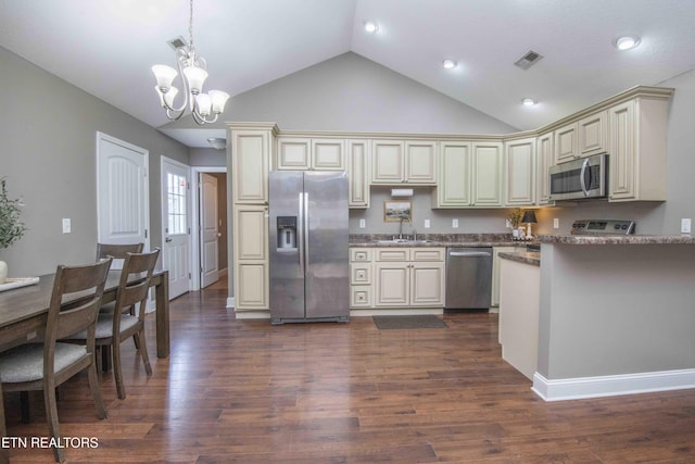 155 Signet Ln, Maynardville, TN 37807 - kitchen featuring appliances with stainless steel finishes, cream cabinetry, a chandelier, dark wood-style flooring, and recessed lighting