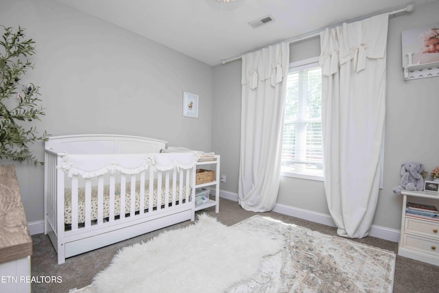155 Signet Ln, Maynardville, TN 37807 - carpeted bedroom featuring multiple windows, a crib, and baseboards