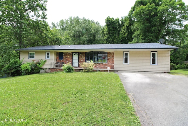 4708 Springbrook Rd, Knoxville, TN 37921 - ranch-style house featuring asphalt driveway, a front yard, and a porch