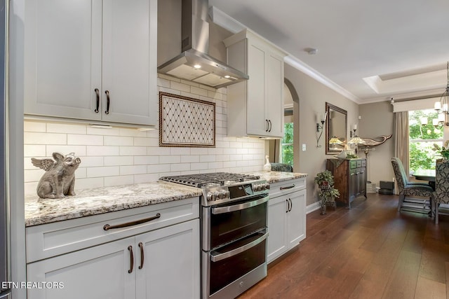 123 Seminole Ln, Loudon, TN 37774 - kitchen featuring appliances with stainless steel finishes, wall chimney exhaust hood, dark wood finished floors, baseboards, and decorative backsplash