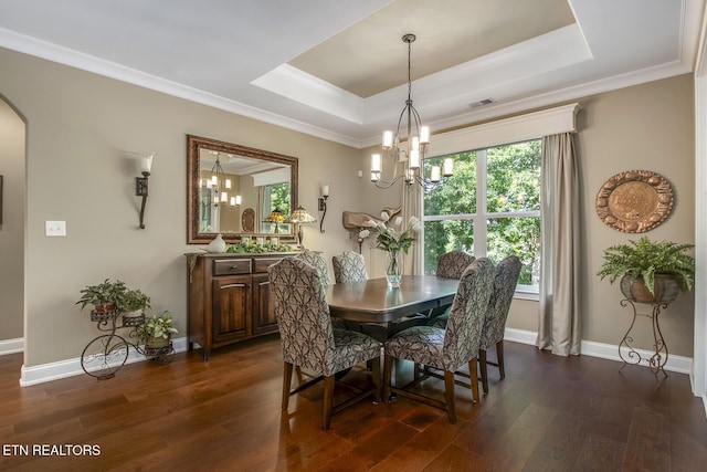 123 Seminole Ln, Loudon, TN 37774 - dining space with a chandelier, dark wood-style floors, a tray ceiling, baseboards, and crown molding