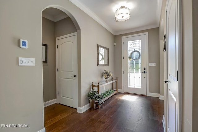 123 Seminole Ln, Loudon, TN 37774 - entryway featuring arched walkways, dark wood finished floors, baseboards, and ornamental molding