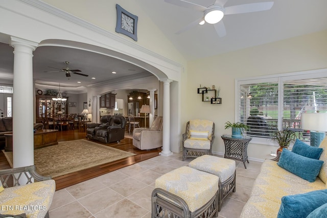 162 Tanasi Lagoon Dr, Loudon, TN 37774 - living room with decorative columns, ceiling fan, light tile patterned floors, arched walkways, and high vaulted ceiling