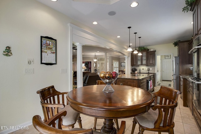 162 Tanasi Lagoon Dr, Loudon, TN 37774 - dining space featuring decorative columns, arched walkways, recessed lighting, light tile patterned floors, and baseboards