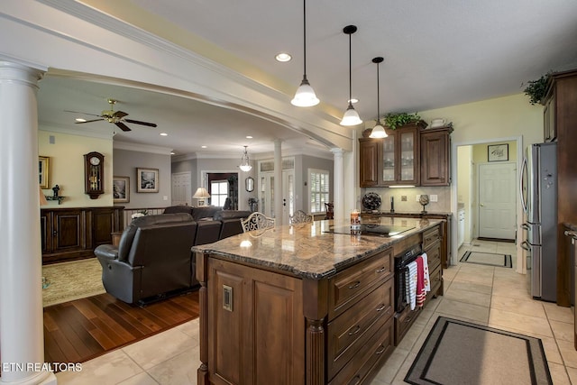 162 Tanasi Lagoon Dr, Loudon, TN 37774 - kitchen featuring ornate columns, black appliances, a ceiling fan, dark stone countertops, and arched walkways