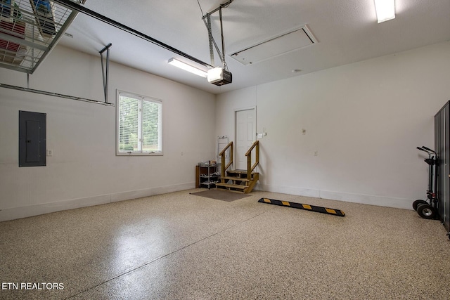 162 Tanasi Lagoon Dr, Loudon, TN 37774 - garage with electric panel, a garage door opener, and baseboards