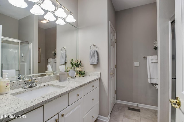 162 Tanasi Lagoon Dr, Loudon, TN 37774 - bathroom featuring vanity, a stall shower, baseboards, tile patterned flooring, and a chandelier