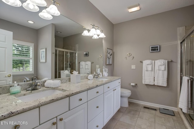 162 Tanasi Lagoon Dr, Loudon, TN 37774 - bathroom with a chandelier, double vanity, a stall shower, and baseboards