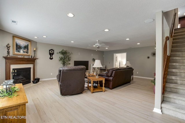 162 Tanasi Lagoon Dr, Loudon, TN 37774 - living area with stairs, baseboards, light wood finished floors, a ceiling fan, and recessed lighting