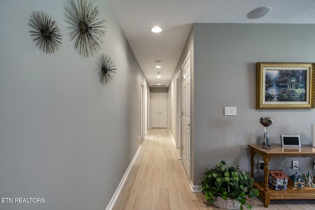 162 Tanasi Lagoon Dr, Loudon, TN 37774 - hall featuring light wood-style floors, baseboards, recessed lighting, and a textured ceiling