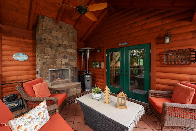 2266 Lone Ridge Dr, Sevierville, TN 37862 - living room with a ceiling fan, an outdoor stone fireplace, wood ceiling, and french doors