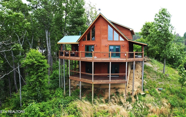 2266 Lone Ridge Dr, Sevierville, TN 37862 - back of property featuring log veneer siding, metal roof, and a deck