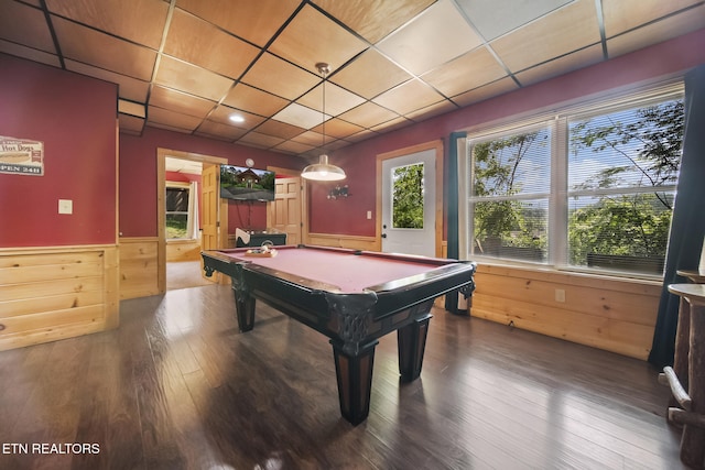 playroom with a wainscoted wall, dark wood-style floors, wooden walls, billiards, and a drop ceiling