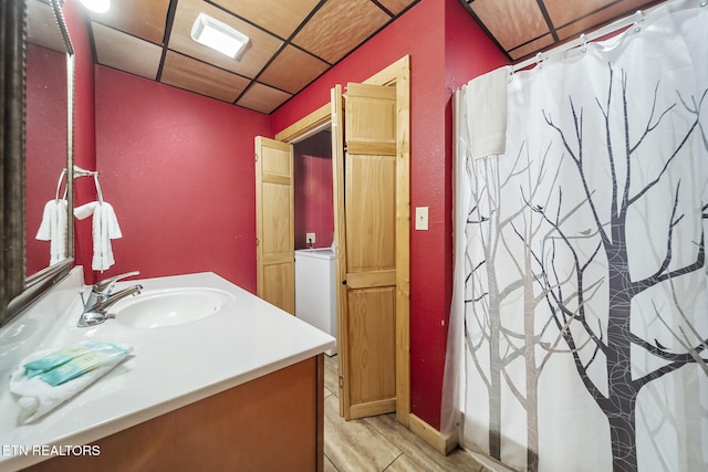 bathroom with vanity, a paneled ceiling, and a shower with curtain
