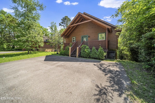 view of front of property featuring faux log siding