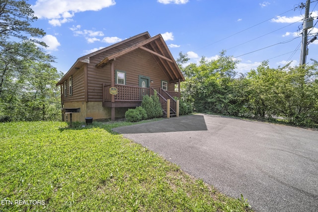 view of home's exterior featuring faux log siding