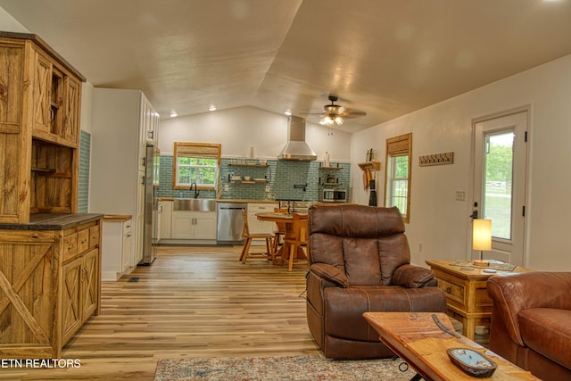 526 Ridge Crest Rd, Jamestown, TN 38556 - living room featuring a ceiling fan, vaulted ceiling, and light wood-style flooring