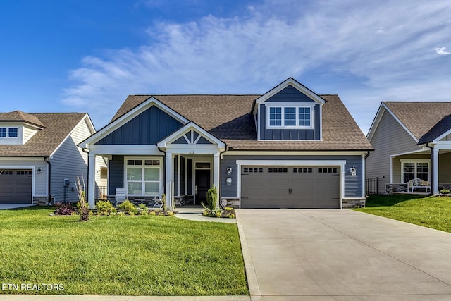 412 Sycamore Pl, Loudon, TN 37774 - craftsman inspired home featuring board and batten siding, a front yard, concrete driveway, and stone siding