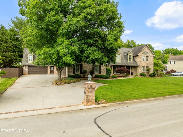 view of front of property with concrete driveway, a garage, and brick siding