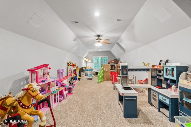 rec room featuring carpet, vaulted ceiling, and ceiling fan