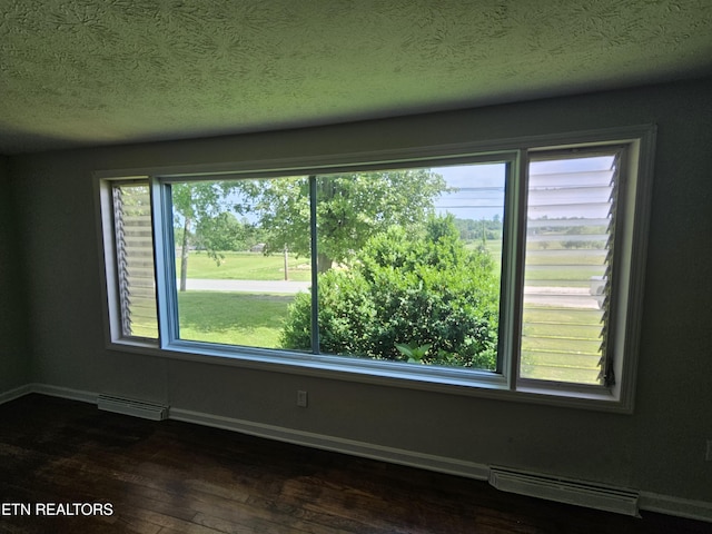 335 Bristol Rd, Harrogate, TN 37752 - empty room with dark wood-style flooring, baseboards, and a textured ceiling