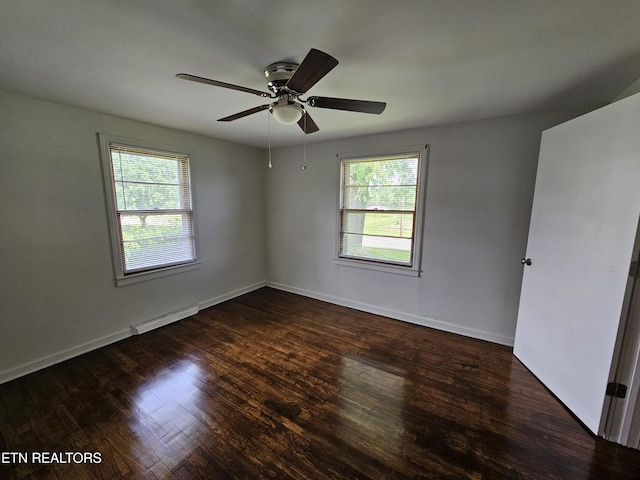 335 Bristol Rd, Harrogate, TN 37752 - empty room featuring a baseboard heating unit, healthy amount of natural light, and wood finished floors