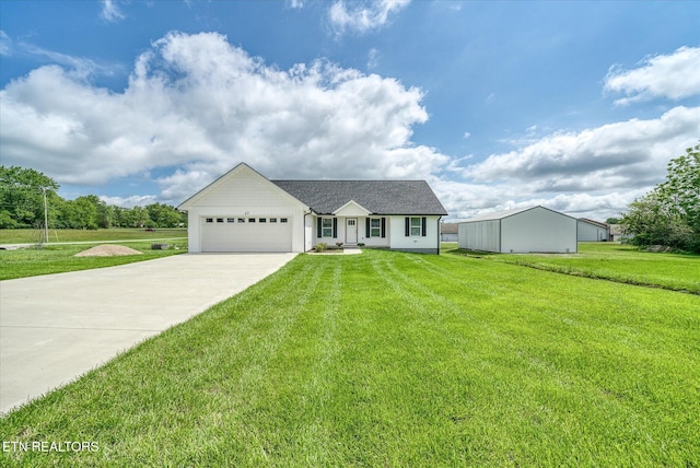 27 Jesse Loop, Crossville, TN 38555 - view of front of house with driveway, a front lawn, and an attached garage
