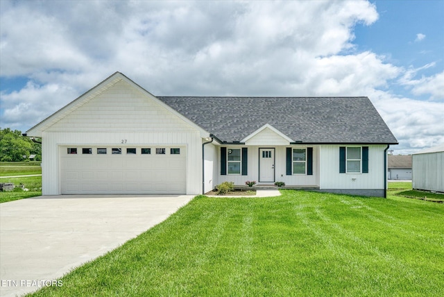 27 Jesse Loop, Crossville, TN 38555 - view of front of house with driveway, a garage, a front yard, and a shingled roof