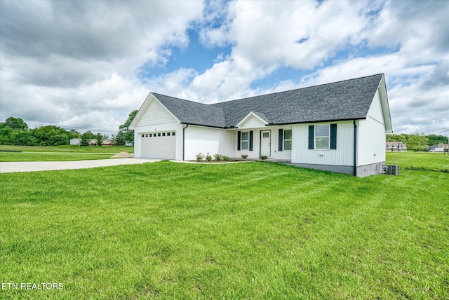 27 Jesse Loop, Crossville, TN 38555 - view of front of property featuring driveway, roof with shingles, a front yard, a garage, and covered porch