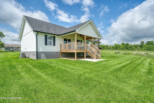 27 Jesse Loop, Crossville, TN 38555 - back of house with a ceiling fan, cooling unit, a yard, and a shingled roof