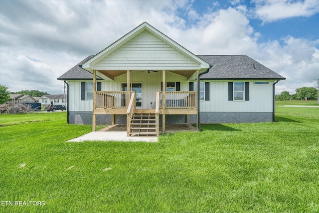 27 Jesse Loop, Crossville, TN 38555 - back of property with a yard, a shingled roof, a deck, and stairs
