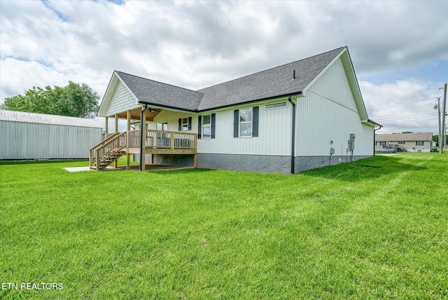 27 Jesse Loop, Crossville, TN 38555 - rear view of house with a lawn, roof with shingles, and stairs