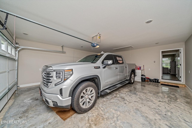 27 Jesse Loop, Crossville, TN 38555 - garage featuring a garage door opener and baseboards