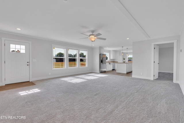 1559 River Path, Morristown, TN 37813 - unfurnished living room featuring light colored carpet, baseboards, a ceiling fan, recessed lighting, and crown molding