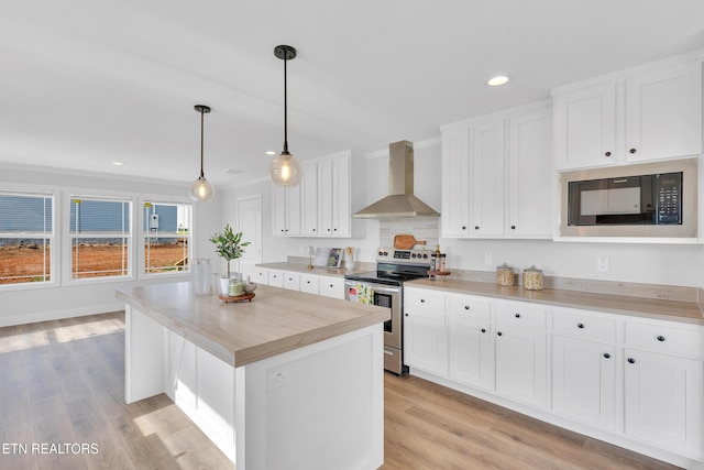 1559 River Path, Morristown, TN 37813 - kitchen with wall chimney exhaust hood, stainless steel range with electric cooktop, black microwave, light countertops, and recessed lighting