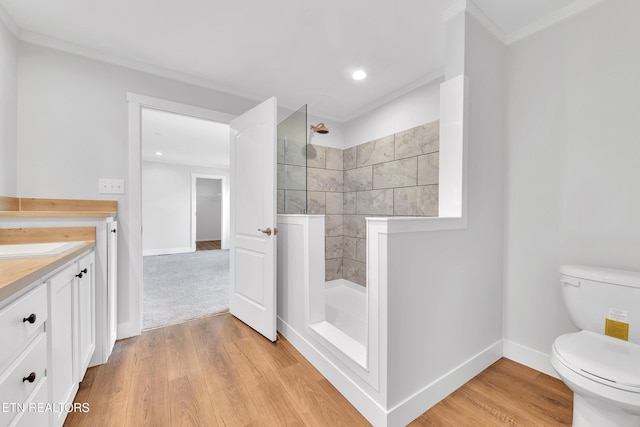1559 River Path, Morristown, TN 37813 - full bathroom with walk in shower, wood finished floors, toilet, vanity, and baseboards