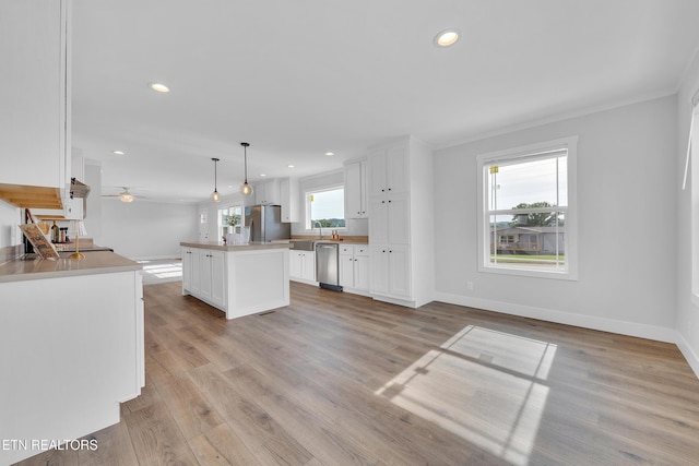 1559 River Path, Morristown, TN 37813 - kitchen featuring appliances with stainless steel finishes, white cabinets, a kitchen island, baseboards, and recessed lighting