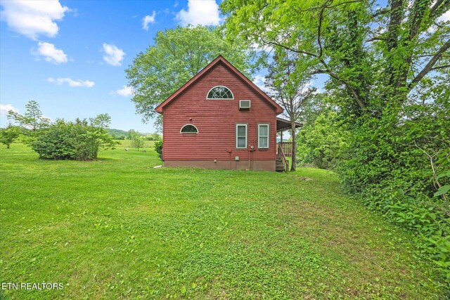 2892 N York Hwy, Pall Mall, TN 38577 - view of property exterior with a lawn