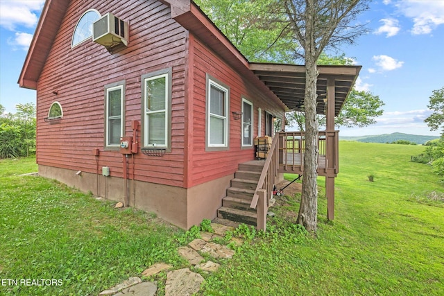 2892 N York Hwy, Pall Mall, TN 38577 - view of property exterior featuring a lawn and a wooden deck