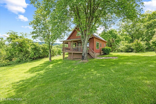 2892 N York Hwy, Pall Mall, TN 38577 - view of grassy yard with stairs and a wooden deck