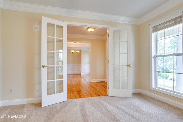 4913 Ivy Rose Dr, Knoxville, TN 37918 - carpeted spare room with french doors, crown molding, and a chandelier