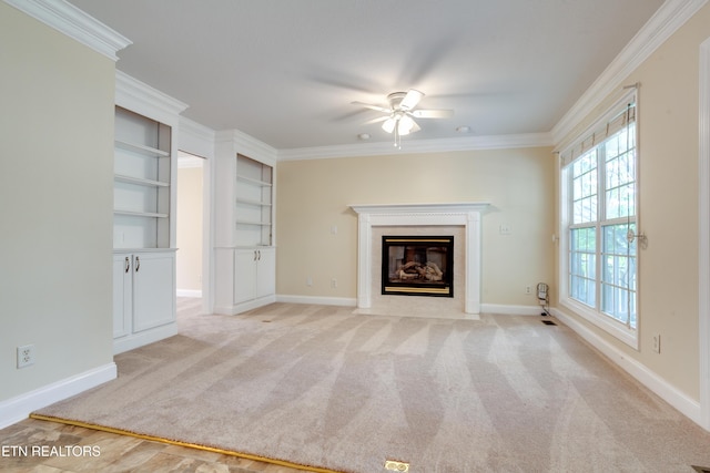 4913 Ivy Rose Dr, Knoxville, TN 37918 - unfurnished living room featuring ceiling fan, a fireplace with flush hearth, crown molding, light colored carpet, and baseboards