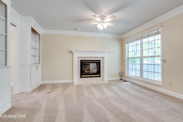 4913 Ivy Rose Dr, Knoxville, TN 37918 - unfurnished living room featuring crown molding, a ceiling fan, a high end fireplace, light carpet, and baseboards